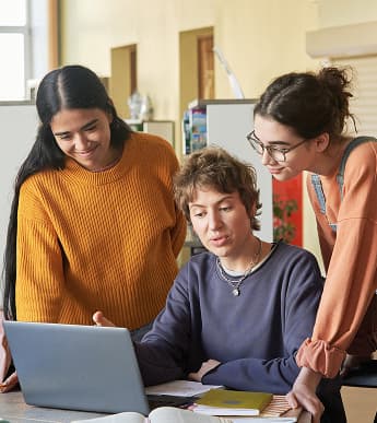 Teacher helping students